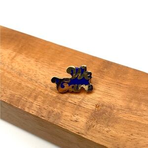 Vintage “We Care” Enamel Pin Gold Tone Blue Script Employee Volunteer Retro